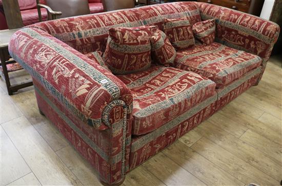 A very large two seater settee, upholstered with an Egyptian taste red, black and cream fabric W.235cm